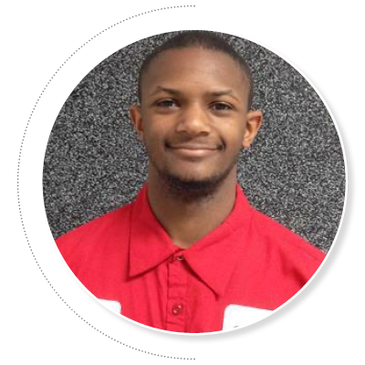 Smiling young African American man in red work shirt