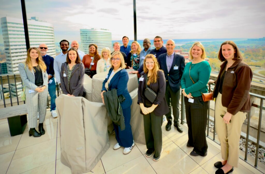 Group Photo of CBRE Employees with Jacques